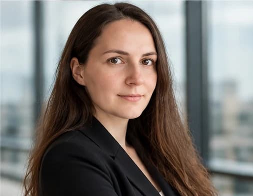 Hanna Railė, Google Ads specialist, in a black blazer by a window